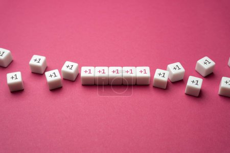 Photo for Growing row of blocks plus one. Get support, more help. Sequential addition to the sum. Increase and growth. Accumulation process. Continuation. Strengthening and growth in numbers. Joint efforts. - Royalty Free Image