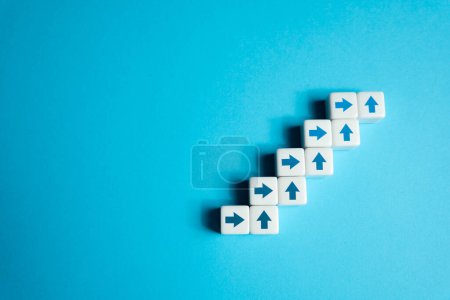 Photo for Steps up from blocks and arrows. Climbs career ladder of success. Going on a new level. Progress and professional growth. Success, self improvement skills and abilities. - Royalty Free Image