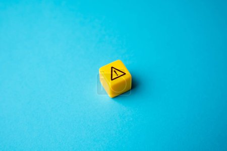 Photo for Warning sign on yellow block. Stress, problems. Something wrong. Danger or problem ahead. Careful proceed with caution. Workplace safety. Potential risks. Stress and mental health - Royalty Free Image