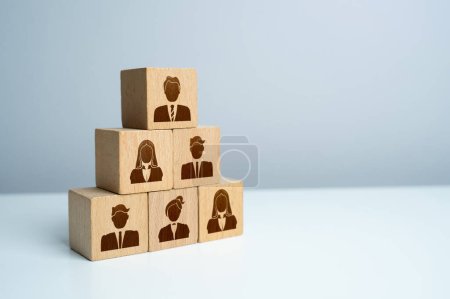 Pyramid of blocks with workers. Putting people in their places. Assemble a team of employees. How many workers can you effectively manage. Hiring and recruiting new members.