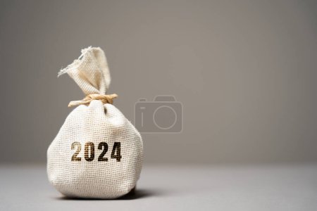 Photo for Money bag 2024. Budget planning concept. Business economic. Goals and plans. Investment, finance, revenues expenses and financing. - Royalty Free Image