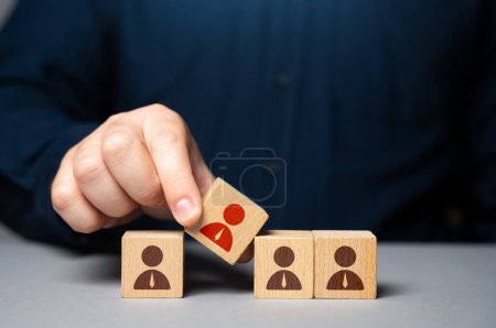 Photo for Inclusion of an incompetent employee in the team. Manipulation of a particular agenda. Installing a subservient leader, easily influenced, and serves the interests of others - Royalty Free Image