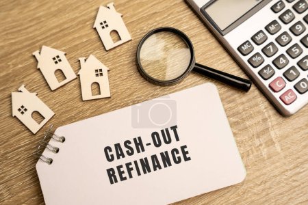 Photo for Cash-out refinance concept. Allows a homeowner to use the equity in their home to get funds. Real estate, credit and mortgage concept. Wooden houses, notes and magnifying glass - Royalty Free Image