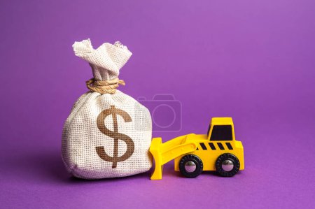 Photo for A bulldozer pushes a dollar money bag. Ineffective use of funds. Financing of dismantling works. Demolition services, land leveling. Industry machinery for rent. Money down the drain. - Royalty Free Image