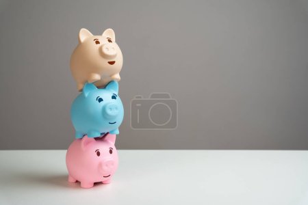 Photo for Tower of three piggy banks. Multiple deposits. Savings and deposit banking. Healthy economy. Diversification of investments and savings. Banking. Good conditions from the bank. Increase capital. - Royalty Free Image