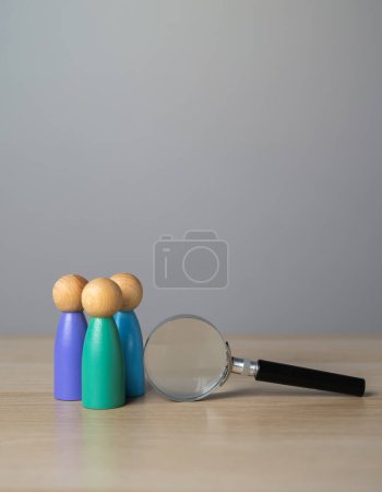 Photo for People figurines and magnifying glass. Diversity or unity. Exploration, introspection, and the desire to delve into the intricacies of the human experience - Royalty Free Image