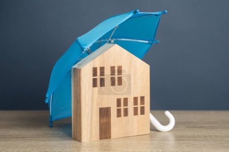 House with blue umbrella. Property insurance. Financial security. Protect investment and be prepared for unforeseen events. Repairs or rebuilding in the event of a covered loss.