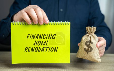 Financing home renovation concept. The concept of investing money in real estate and home repair. Accumulation and financial management. Money bag and notepad in the hands of a businessman
