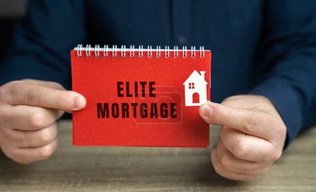 Photo for Elite mortgage concept. Personalized service, competitive interest rates, flexible terms, and access to special programs or benefits. Real estate and loan. Notepad in the hands of man and a house - Royalty Free Image