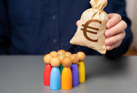 A businessman holds a euro money bag near a group of people figurines. Preferential loans for entrepreneurs and businesses. Allocation of budget money for projects. Social support.