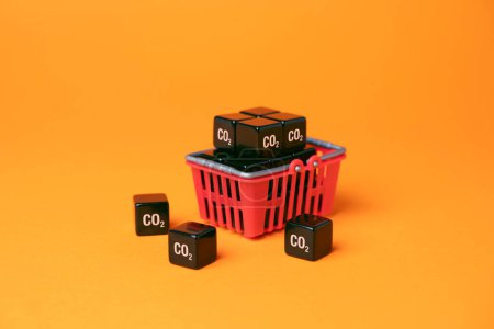 Shopping basket and cubic CO2 carbon dioxide. Customers carbon footprint. Achieve an understanding of impact on the environment by your lifestyle and habits. Greenhouse gas consumption and footprint.