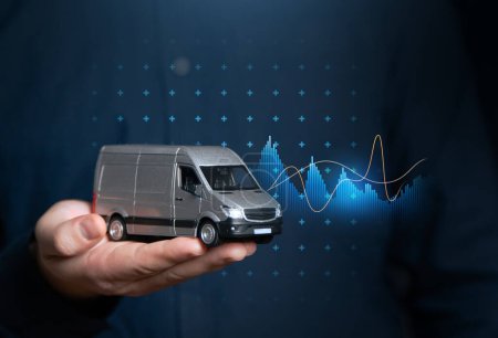 Transport goods. Businessman and delivery van with charts. Transport industry. Increased profits when delivering online orders. Optimizing supply chains, reducing costs. Automation, unmanned vehicles.