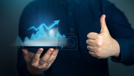 Businessman showing successful growth and thumbs up. Achieve business revenue growth goals. Growth of indicators, optimistic forecasts. Stock prices, trading on the stock exchange. Economy
