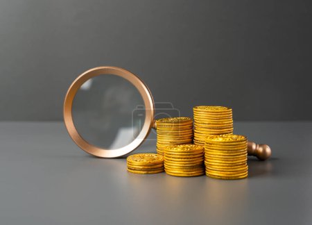 Magnifying glass and money coins stack. Search for financing and investment opportunities. Savings and deposits. Lending. Economy. Monetary policy, interest rates.