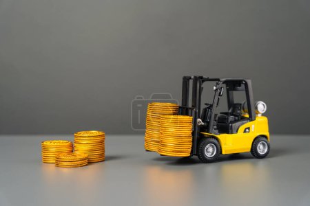 Photo for A forklift brings cash coins. Attracting investments. Brings profit and earnings. Injecting funds into the economy and industrial sector. Subsidization. Advantageous loans for industry and production. - Royalty Free Image