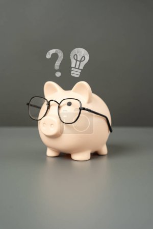 Idea for business and investment. Invest in a startup. Accounting and auditing. To earn money. Deposits and investments. Financial planning and literacy. Save for education. Piggy bank with glasses