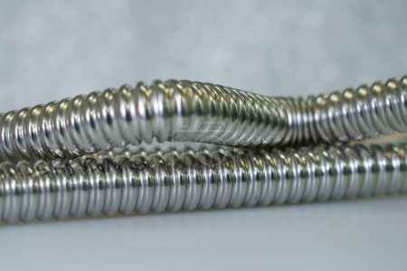 Photo for Stainless steel flexible hoses and flexi pipes, fittings and pressure joints. - Royalty Free Image