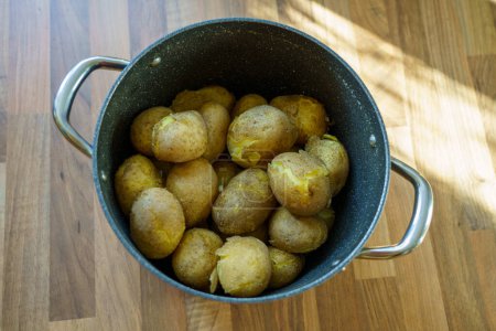 Photo for Boiled potatoes in a pot in the kitchen close-up. - Royalty Free Image
