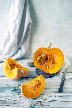 Photo for Pumpkin slices with seeds on wooden background, selective focus - Royalty Free Image