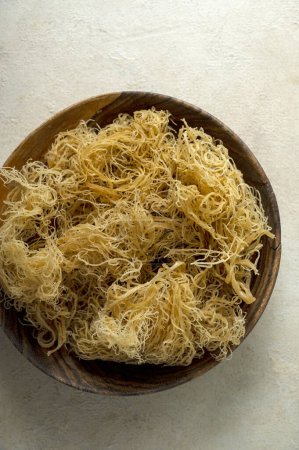 Golden dried Sea Moss, healthy food supplement rich in minerals and vitamins used for nutrition and health.