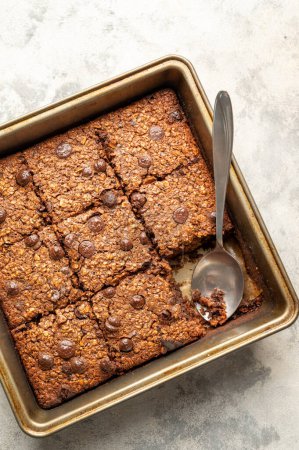 Healthy, vegan brownies with chocolate chips and rolled oats, macro food texture