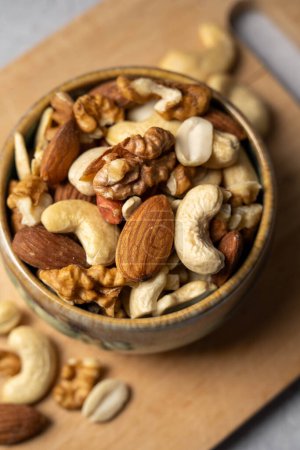 Photo for Mix of nuts cashews, almonds, hazelnuts in a small bowl - Royalty Free Image