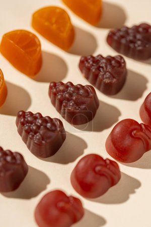 Photo for Multivitamin gummies, fruit shaped. Healthy food supplement concept - Royalty Free Image