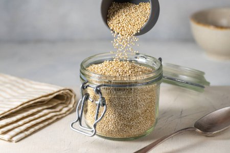 Photo for Dry quinoa uncooked in a glass jar.Healthy eating - Royalty Free Image