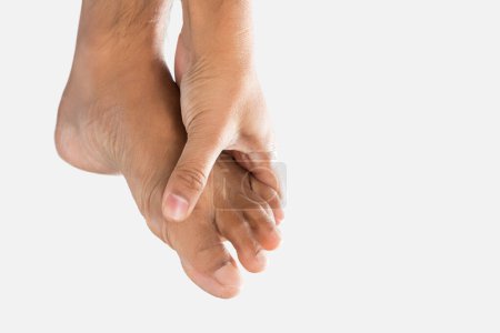 Photo for Cramps in the foot and toes. On a gray background. - Royalty Free Image