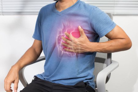 Photo for An Asian man has chest tightness due to a heart attack. Coronary artery disease - Royalty Free Image