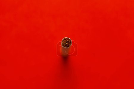 Photo for Cigarette on red background . Bad habit . Bloody background - Royalty Free Image