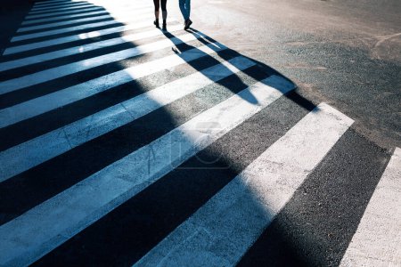 Téléchargez les photos : People Crossing City Street . Shadow on Urban Crosswalk - en image libre de droit