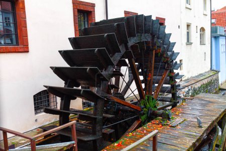 Hydro powered river wheel . Wooden wheel at flowing water 
