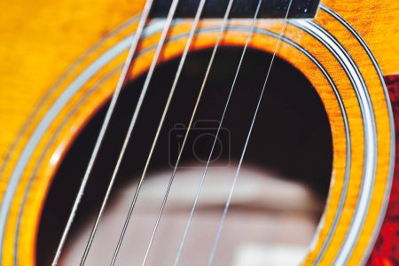 Photo for Acoustic guitar strings over the hole, shallow depth - Royalty Free Image