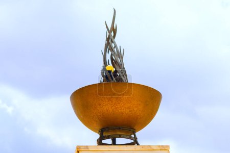 Fire monument made of copper. Carved fire in metal