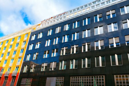 Photo for Modern apartment buildings on a sunny day with a blue sky. Facade of a modern apartment building. Berlin typical architecture - Royalty Free Image