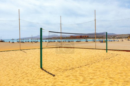 Volleyball net on the sandy beach. Playa del Castillo in Fuerteventura, Canary Island