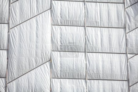 White fabric texture background. Construction protection cloth