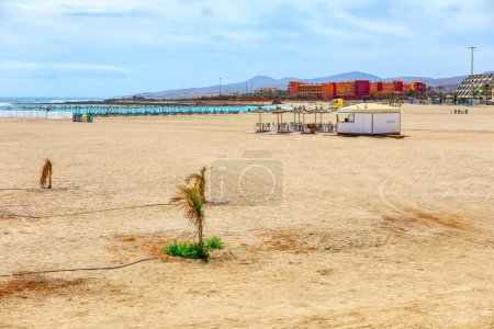 Playa del Castillo in Fuerteventura, Canary Islands. Large sandy tropical beach at ocean coast  