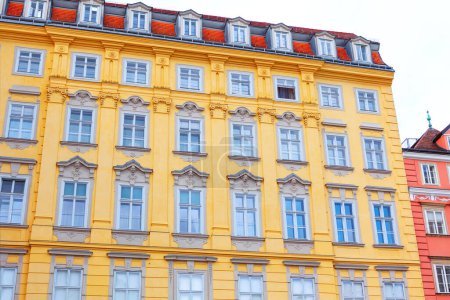 Architecture of old town of Vienna, Austria. Building with attics and yellow wall