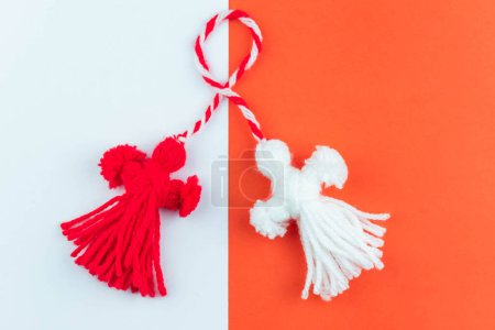 Photo for Traditional Martisor - symbol of holiday 1 March, Martenitsa, Baba Marta, beginning of spring and seasons changing in Romania, Bulgaria, Moldova. Greeting and post card for holidays. - Royalty Free Image