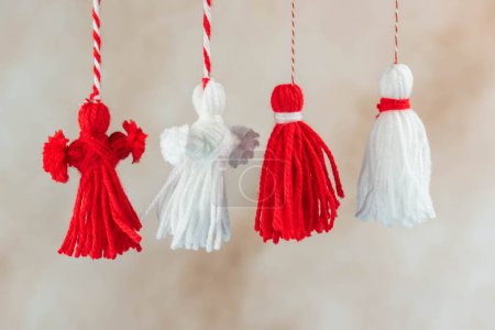 Photo for Traditional Martisor - symbol of holiday 1 March, Martenitsa, Baba Marta, beginning of spring and seasons changing in Romania, Bulgaria, Moldova. Greeting and post card for holidays. - Royalty Free Image
