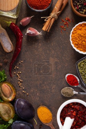 Photo for Variety of spices and herbs on table background. Cooking concept and ingredients at table top view - Royalty Free Image