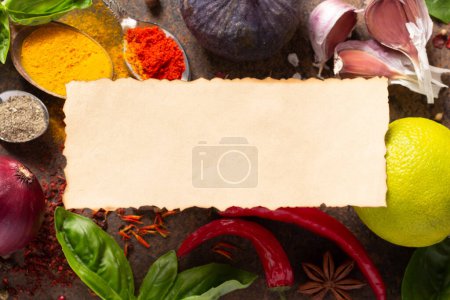 Photo for Variety of spices and herbs with paper label on table background. Cooking concept and ingredients at table top view - Royalty Free Image