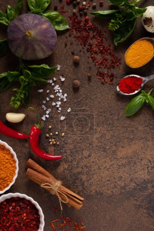Photo for Variety of spices and herbs on table background. Cooking concept and ingredients at table top view - Royalty Free Image