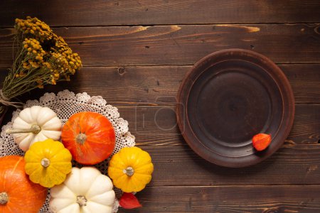 Photo for Pumpkin on wooden table as autumn still life - Royalty Free Image