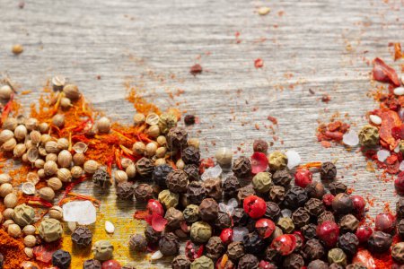 Photo for Pepper spice mix and variety of spices on table background. Cooking food ingredients top view - Royalty Free Image