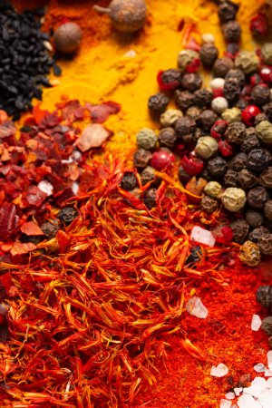 Photo for Pepper spice mix and variety of spices on table background. Cooking food ingredients - Royalty Free Image