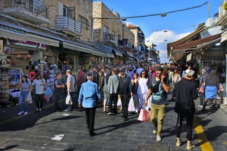 Photo for JERUSALEM - NOV 11 2022:Israeli people shopping at Mahane Yehuda Market on a busy Friday.The market is popular with locals and tourists alike with more than 250 vendors sell fresh food and other goods - Royalty Free Image