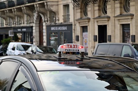 Photo for PARIS - NOV 30 2022:Parisian Taxi in Paris, France.Paris and its suburbs have nearly 18,000 licensed taxis. - Royalty Free Image